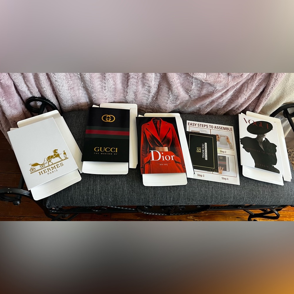 Set of four decorative faux luxury books. Dior, Hermes, Vogue and Gucci.